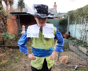 A boy in the collar, hat and waistcoat you can make on this page